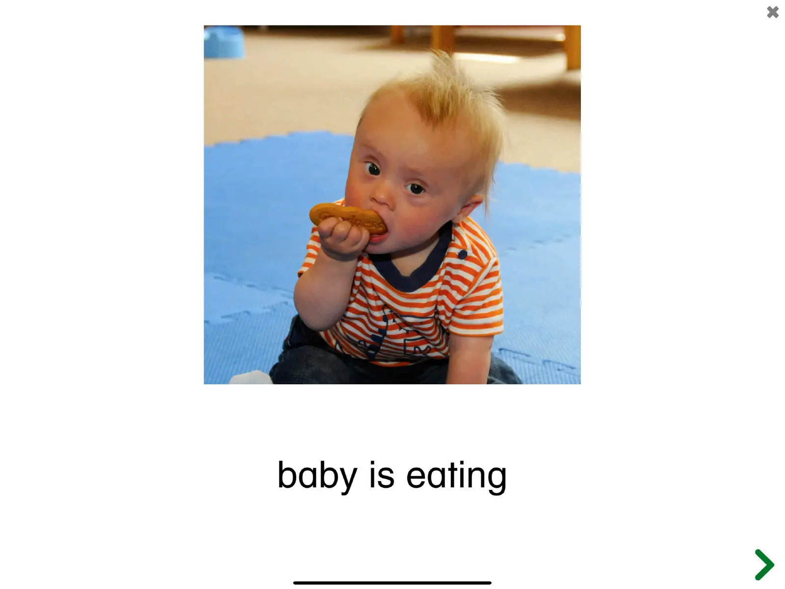 Screenshot of the See and Learn Phrases 1 app showing the phrase 'Baby is eating'