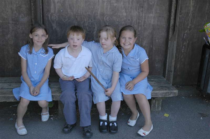 A photograph of school children, including children with Down syndrome