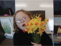 Ynez holding a bunch of daffodils